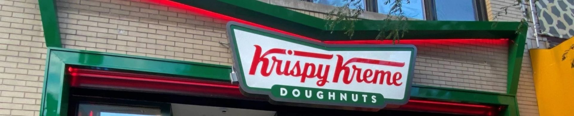 Krispy Kreme storefront in the daytime