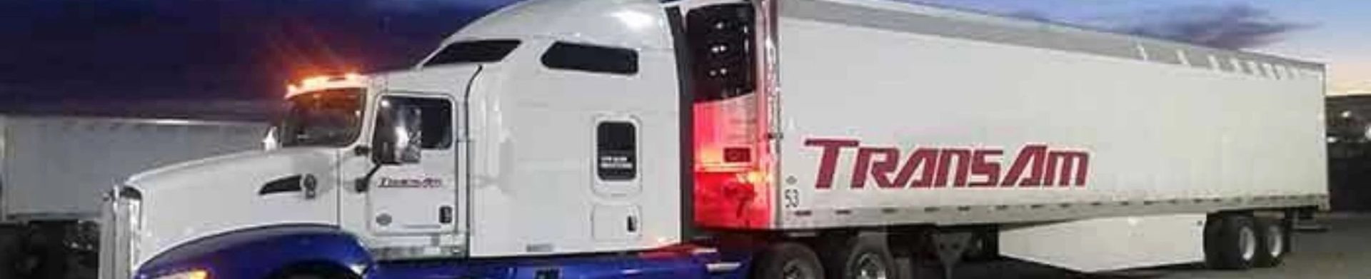 TransAm Trucking freight truck during nighttime