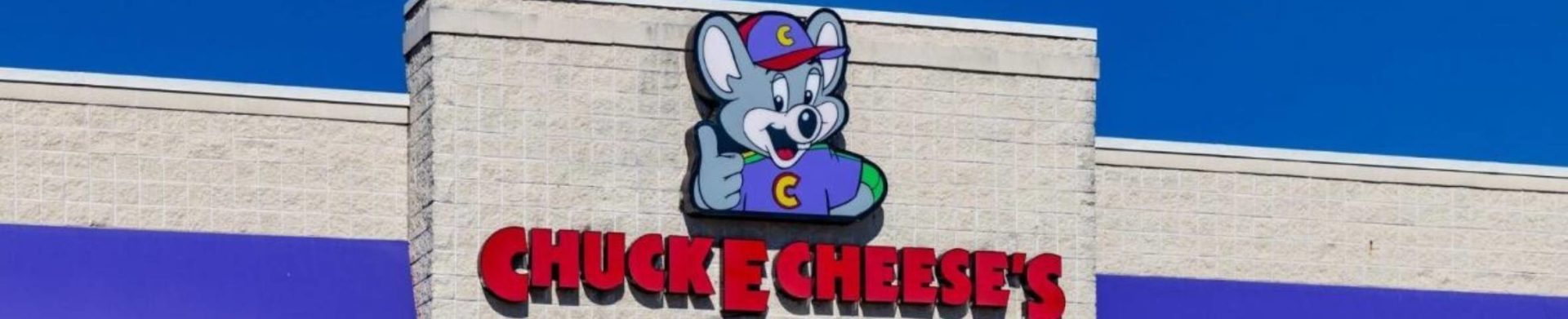 the Chuck E Cheese logo on a restaurant